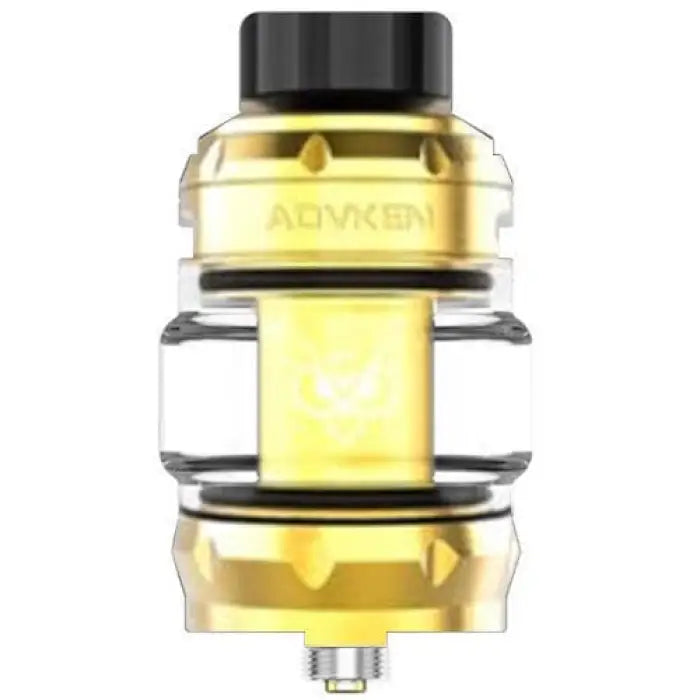 Vaping tank or atomizer with gold-colored metal components and a clear glass section.