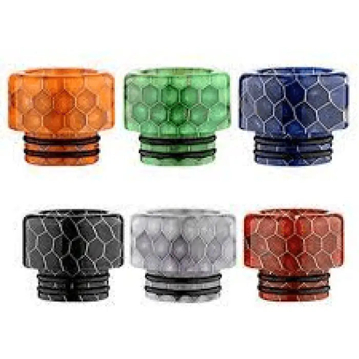 Colorful honeycomb-patterned drip tips for vaping devices in various hues.