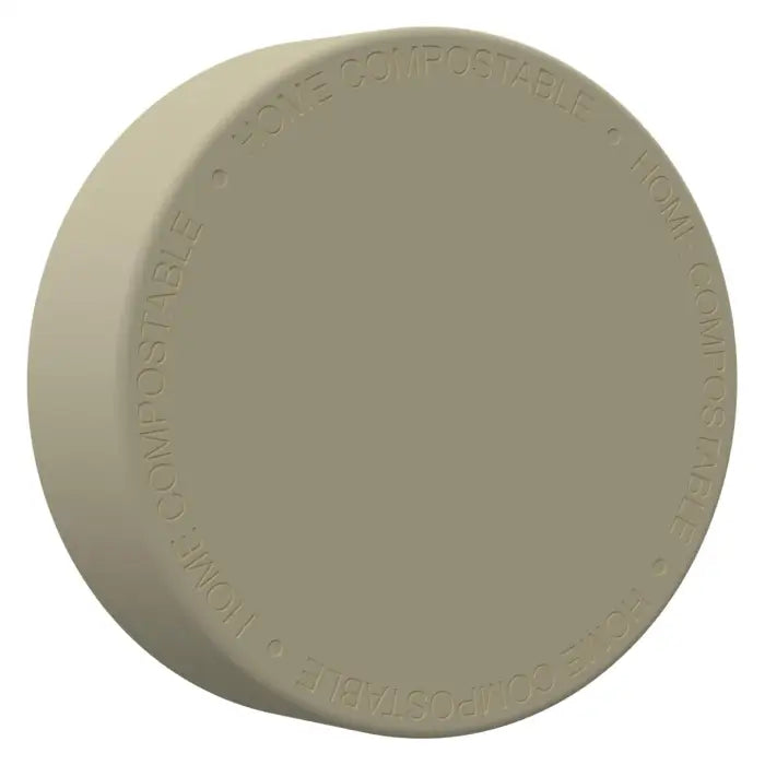 Circular beige or light gray disc with embossed text around the edge.