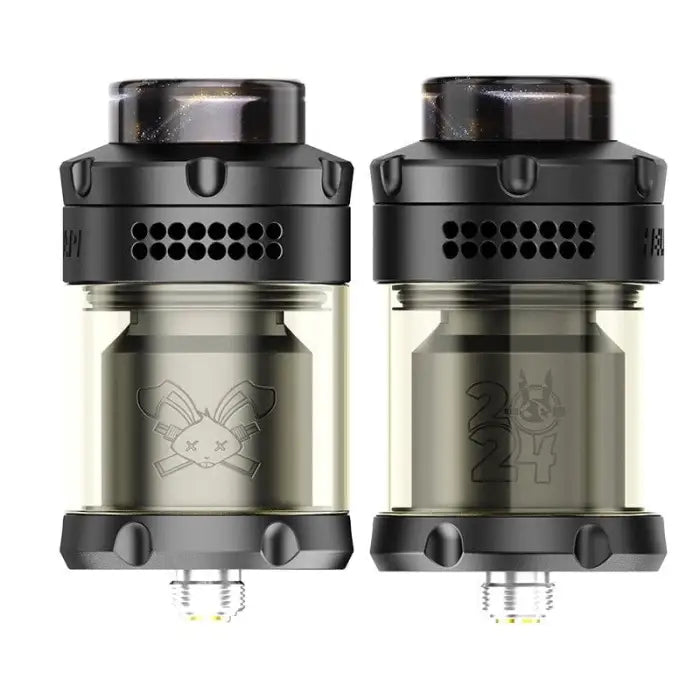 Two black and transparent vaping tanks or atomizers with cartoon animal designs etched on the glass sections.