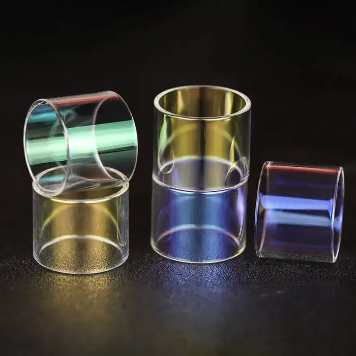 Glass or acrylic cylinders with colorful iridescent reflections.