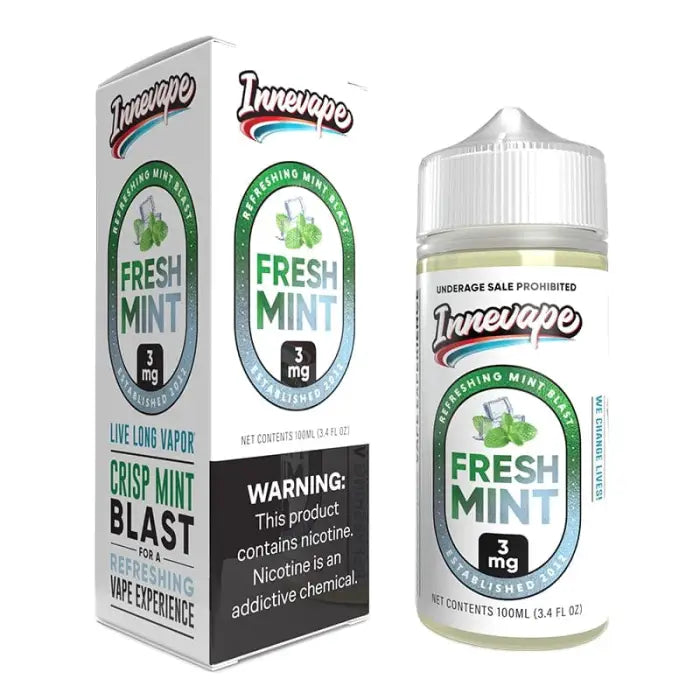 E-liquid bottle labeled ’Fresh Mint’ with accompanying product packaging.