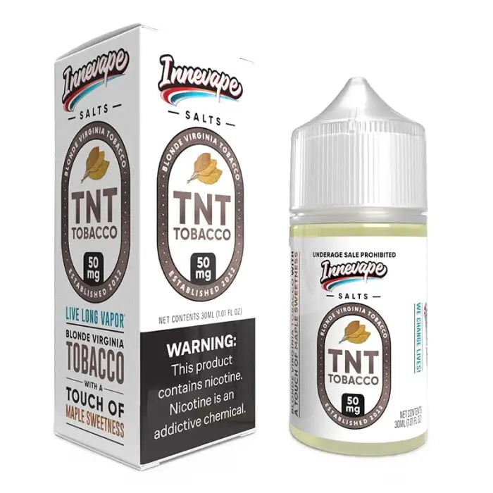 E-liquid bottle labeled ’TNT Tobacco’ with accompanying product packaging.