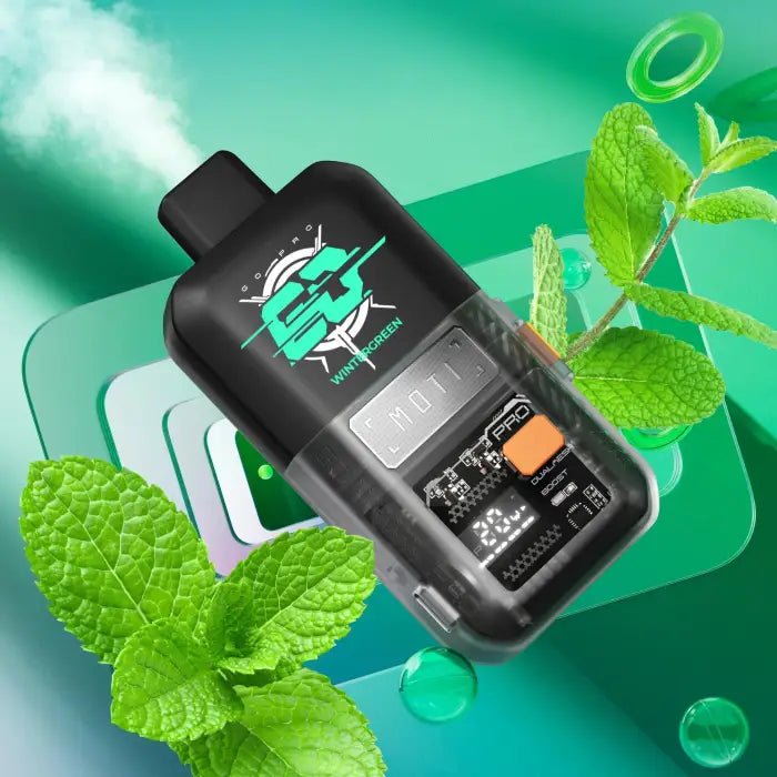 Electronic vaping device with a digital display and buttons, surrounded by mint leaves.