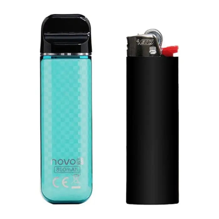 Teal-colored electronic vaping device next to a black lighter.