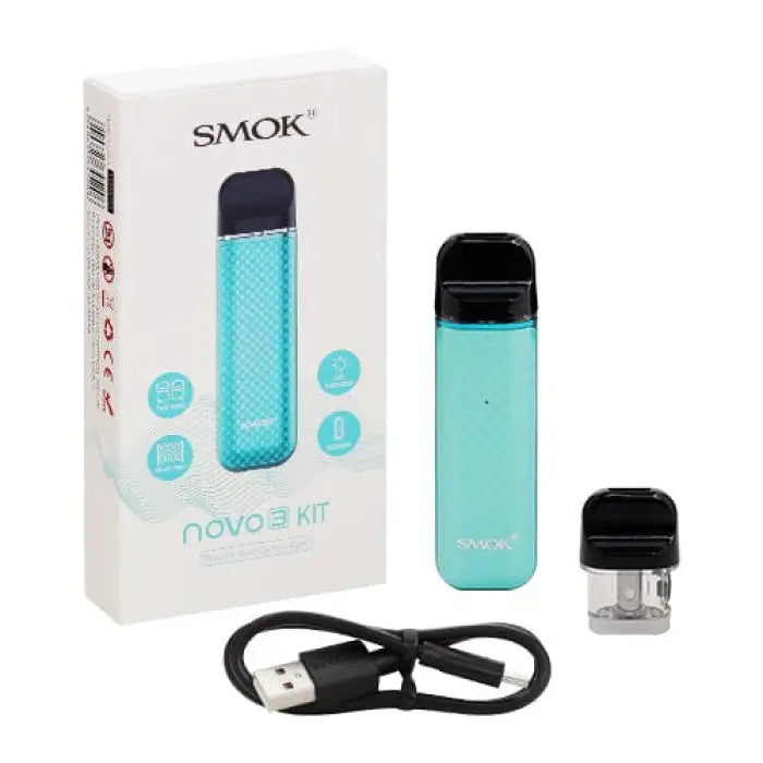 Electronic cigarette or vaping device kit with a teal-colored body and accompanying accessories.