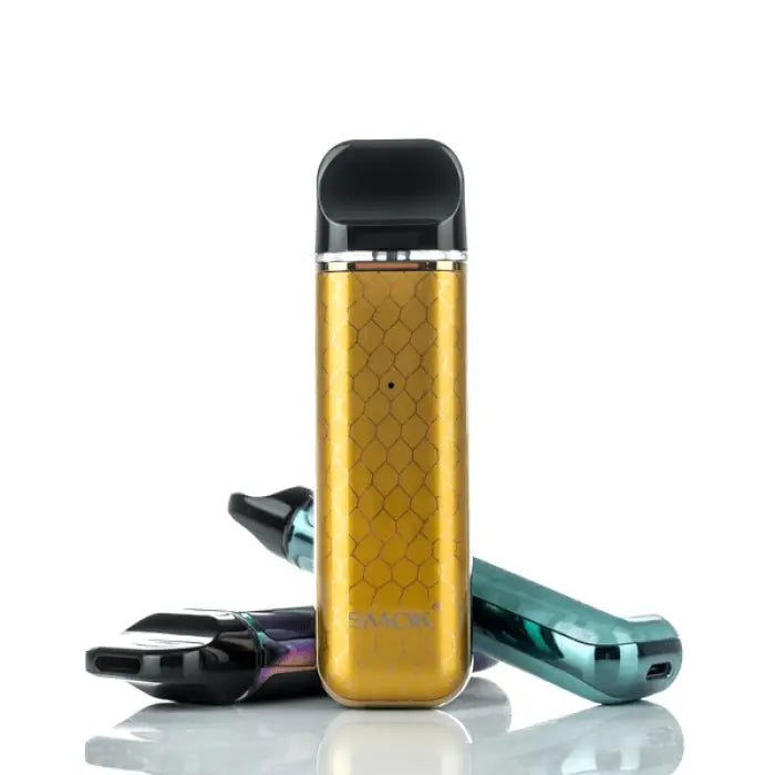 Gold-colored electronic vaping device with a sleek, rectangular shape and black mouthpiece.