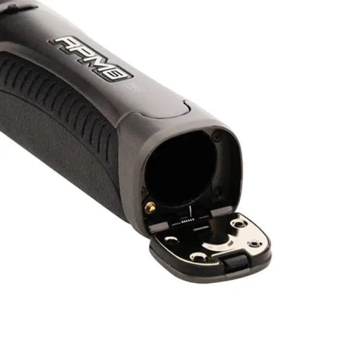 Electric hair clipper or trimmer with an open blade compartment.