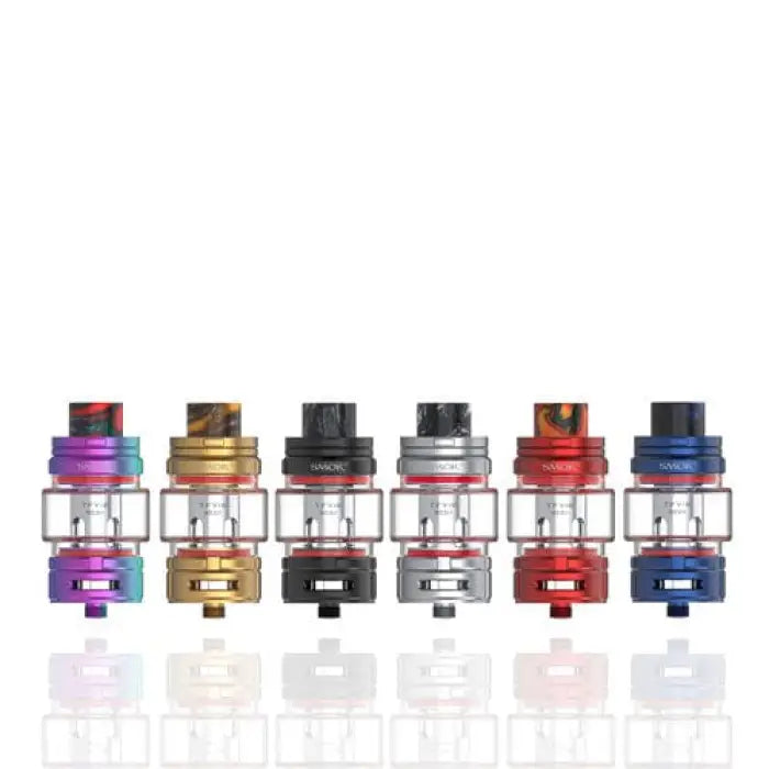 Set of colorful vaping tanks or atomizers in various metallic finishes.