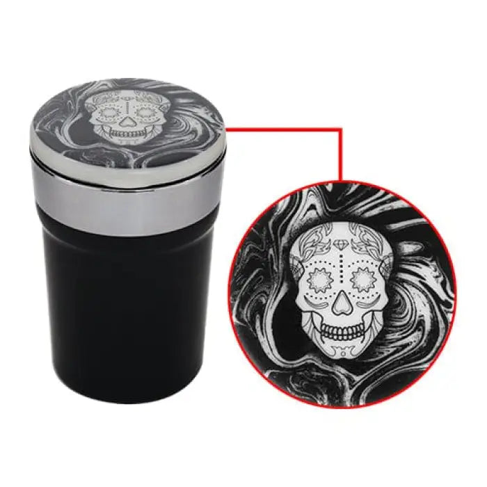 Insulated travel mug with a decorative sugar skull design on the lid.