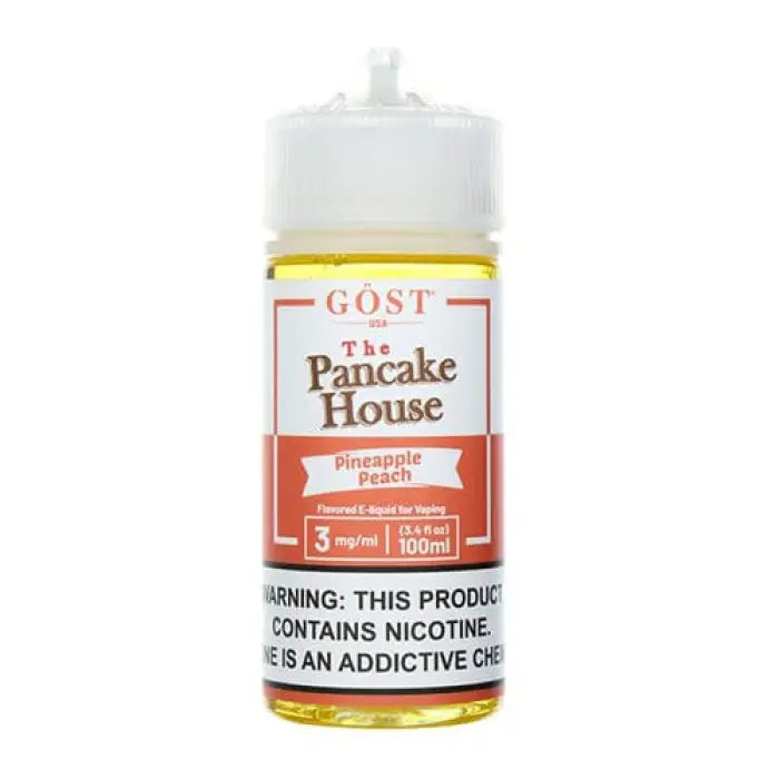 Bottle of e-liquid labeled ’GOST The Pancake House’ in pineapple peach flavor.