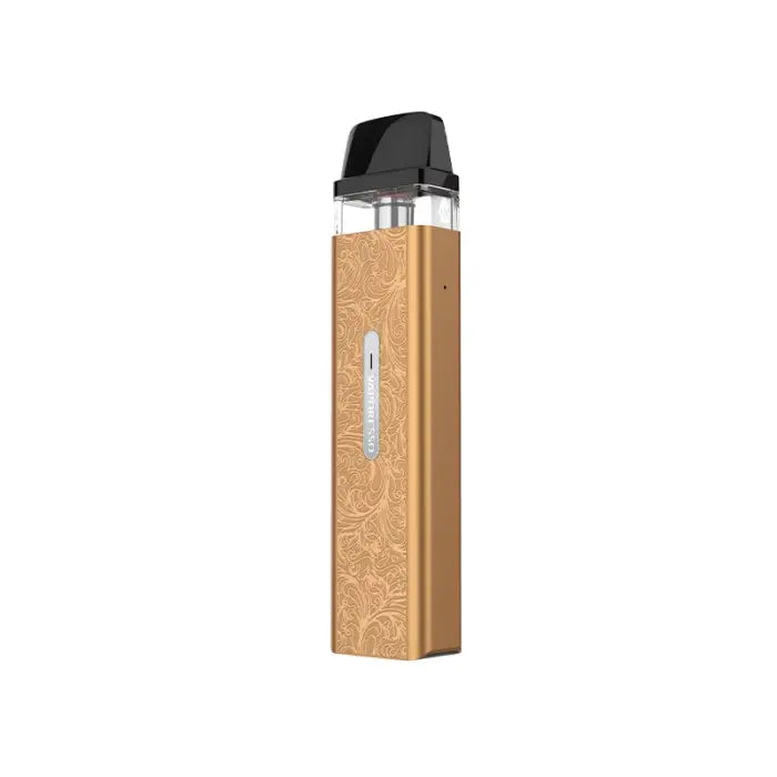 Gold-colored vape pen or e-cigarette device with engraved floral patterns.