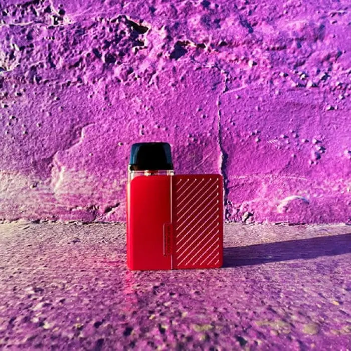 Red electronic vaping device with a textured surface.